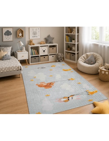 Tapis enfant animaux et étoiles dans une chambre bébé moderne