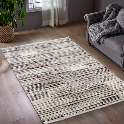 Tapis moderne beige et taupe à motif graphique